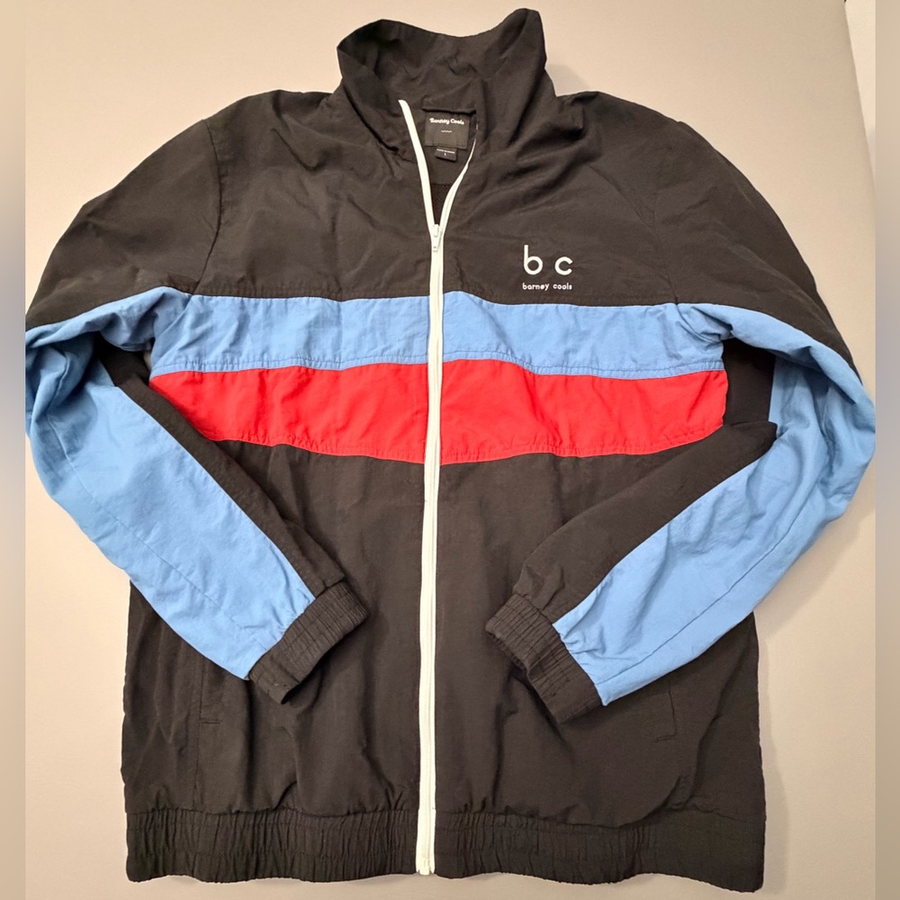 Barney Cools Black Windbreaker with Red and Blue Accents‎